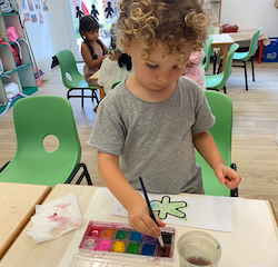 Osian is enjoying his UN day craft!