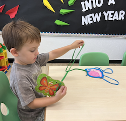 Ben enjoying lacing activity