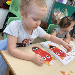 Isabelle is working on her CNY craft.