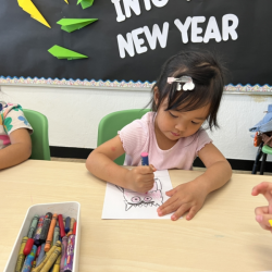 Allie is working on colour monster craft.