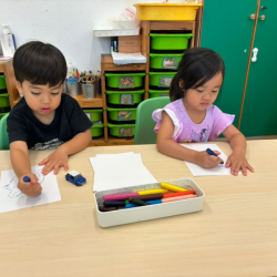Allie & Niko focused on drawing