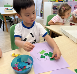 Avery is focused on his mother's day  craft.