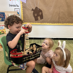 Osian confidently explaining how his pirate ship works