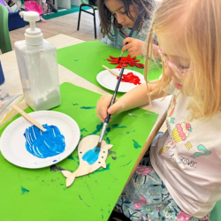 Poppy & Artie concentrating on their sea creature painting