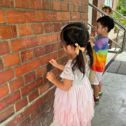 Allie & Avery enjoying writing their names with chalk