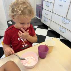 Sol is having fun with  making hot cocoa & marshmallow