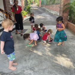 Drawing with sidewalk chalk.