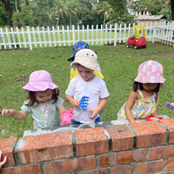 Having fun in the mud kitchen.
