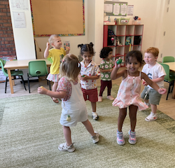 Having fun using the egg shakers during the song “Shake your sillies out!”