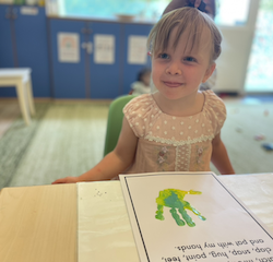 Izzy is so pleased with her handprint art!