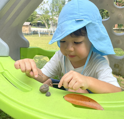 Niko is showing us the treasures he found in the garden today.