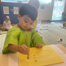 Niko is working on his lantern art.