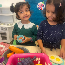 Nila and Ruhi are having tea and eggs for breakfast.