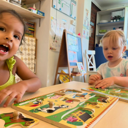 Ruhi and Izzy are enjoying putting puzzles together.