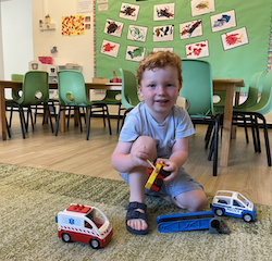 Sebastian is so happy to play with the cars!