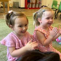 Victoire and Izzy singing together during music snd movement.