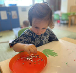 Victoire working on her Christmas art.