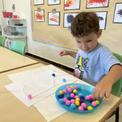 Romy working on his letter artwork.
