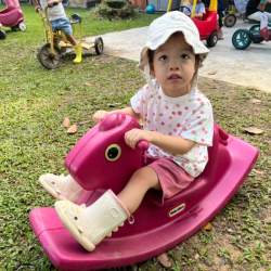 Maya enjoying outdoor play.