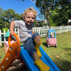 Spike enjoying the slide. 