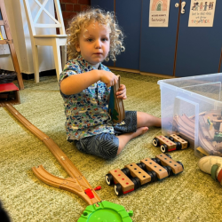 Spike enjoying the train set