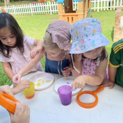 Experimenting with vinegar and baking soda to see the reaction. It makes bubbles!
