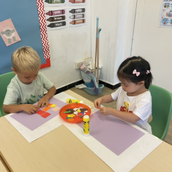Marceli and Maya doing their art work.