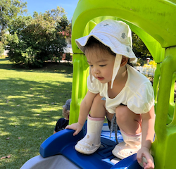 Maya enjoying outdoor play.