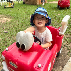 Out for a ride in the red car.