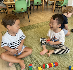 Rowan and Daniel talking during free play.