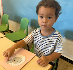 Rowan working on his arts and crafts.