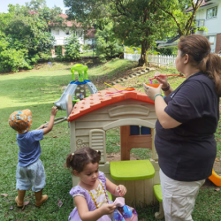 Using our 'circle wands' to blow bubbles!
