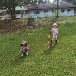 Who can throw the rainbow ball the furthest.