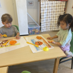 Ellie and Leo exploring the texture of play dough