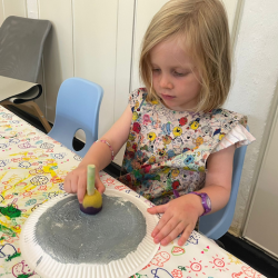 Sponge printing a moon.