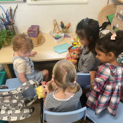 Taking care of baby dolls.