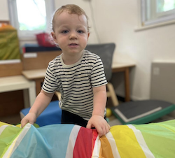 Arthur enjoys playing in the soft playroom!