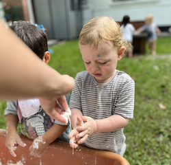 Arthur exploring the runny feeling of goop!