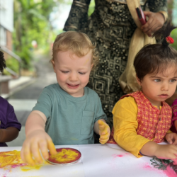 Arthur having fun with Rangoli.