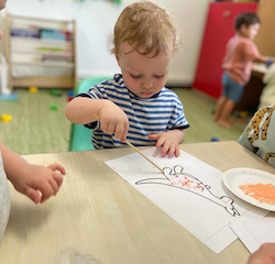 Arthur loved using lots of pink and orange in his painting!