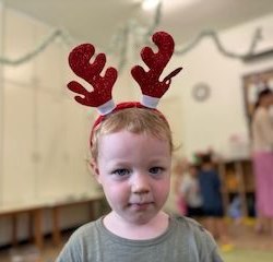 Arthur loving his reindeer headband!