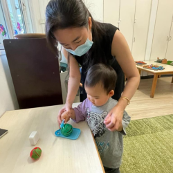 Cara slicing up a watermelon in pretend play!