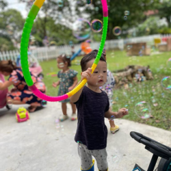 Daniel fascinated with the bubble machine!