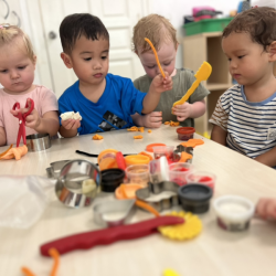 Eleanor, Mateo, Arthur and Rowan working with Halloween themes dough play manipulatives!