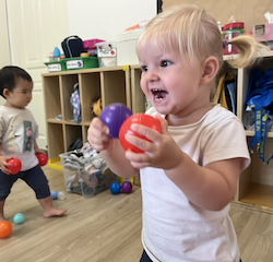 Eleanor having great fun with the plastic balls!