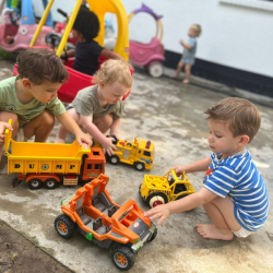 Jasper, Arthur and Romy having fun with construction vehicles.