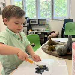 Johnny painting his cat!