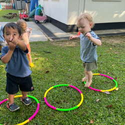 Mateo and Arthur walking through hoops placed on the ground!
