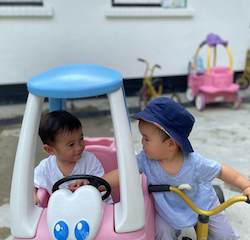 Mateo and Cara having fun together during outdoor play