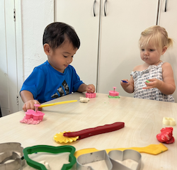 Mateo and Eleanor working with Christmas cutters!
